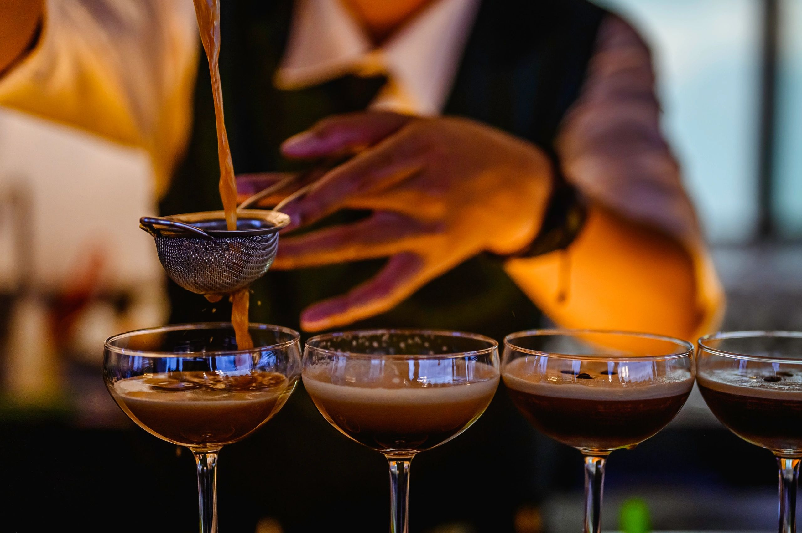 Bartender preparing an alcoholic cocktail at the bar