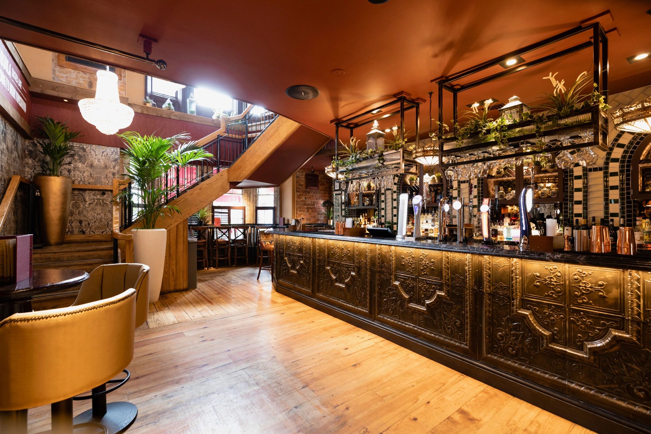 Elegant bar interior with backlit bottles and seating