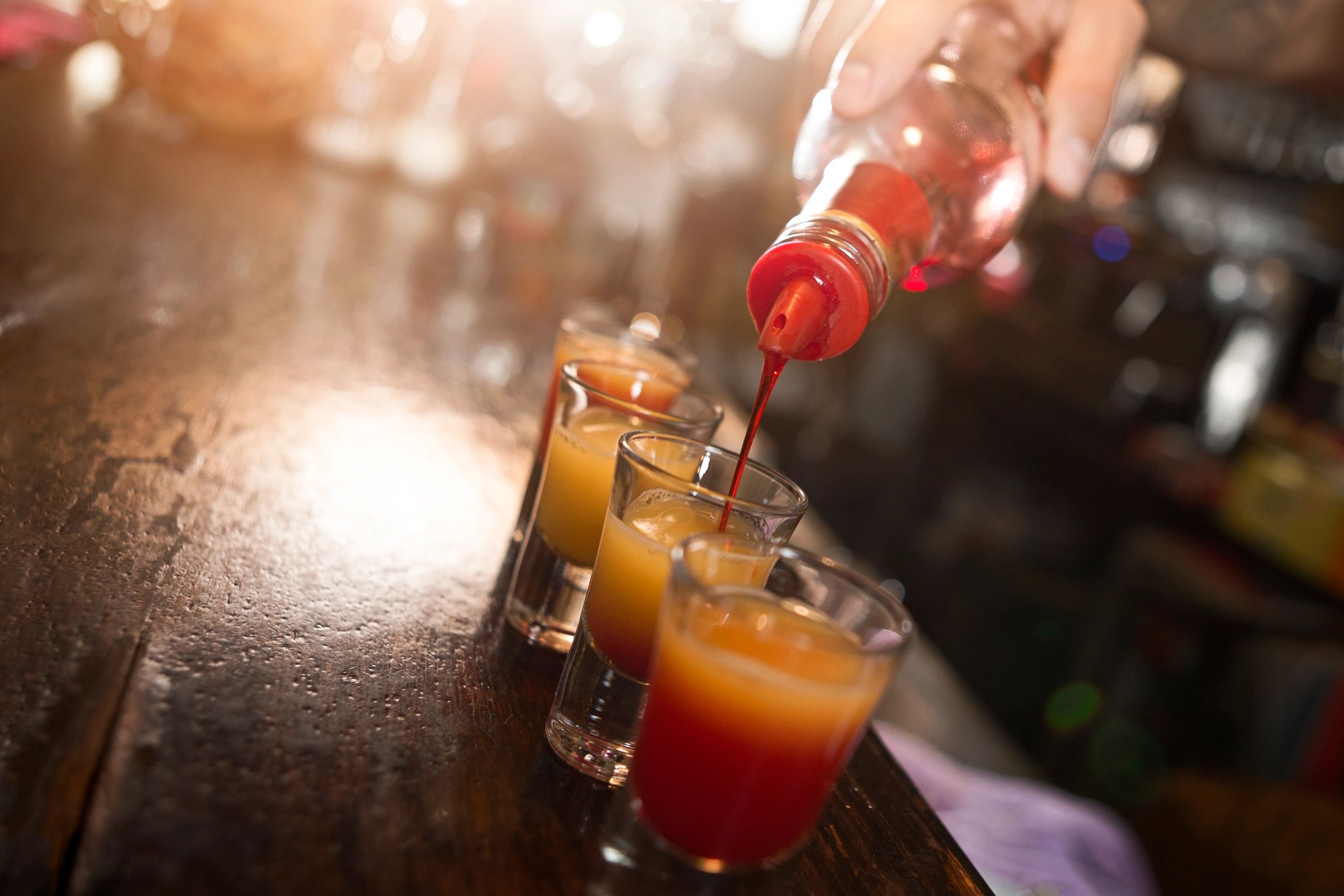 Bartender pouring a cocktail