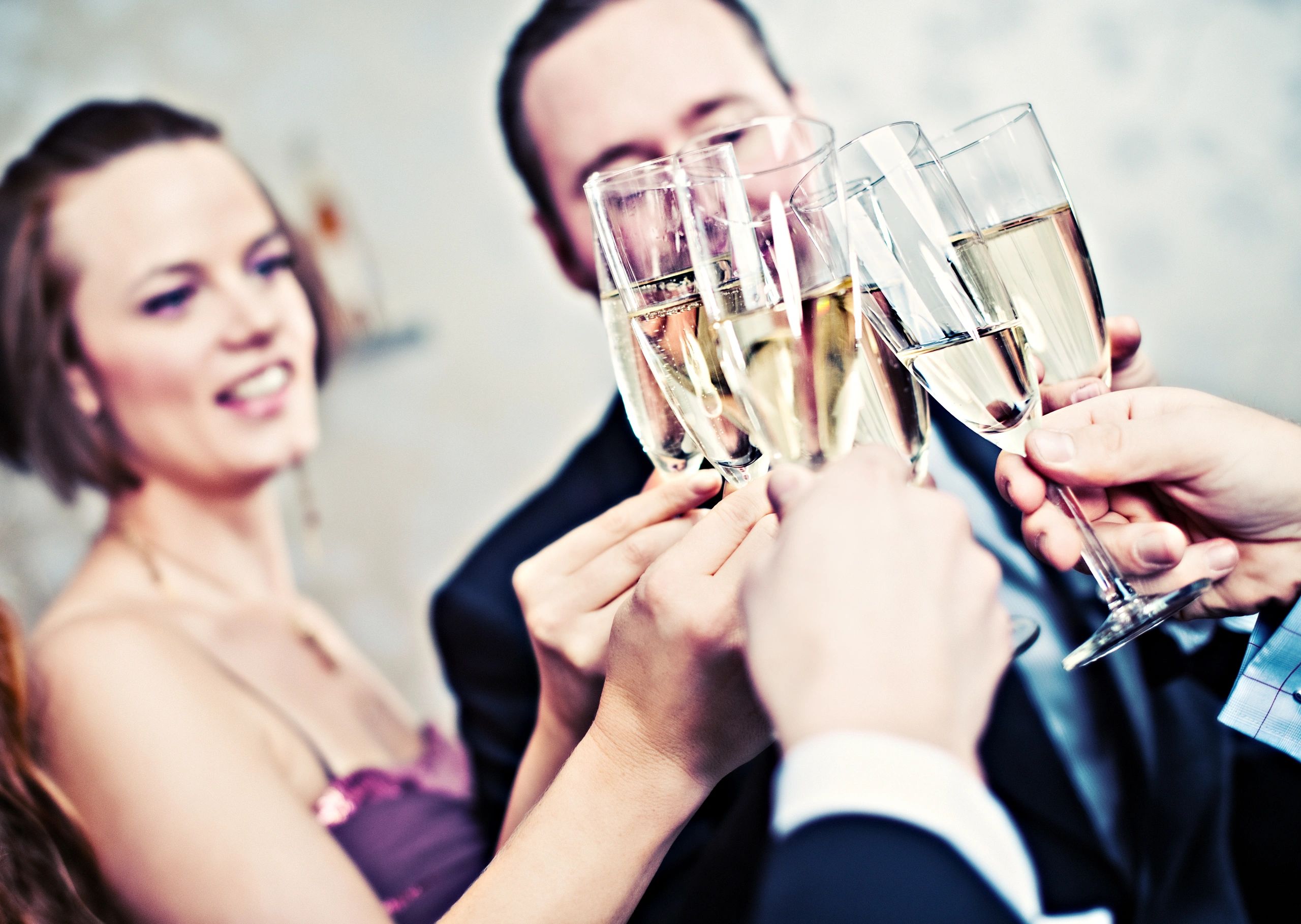 Guests toasting with drinks at a celebration