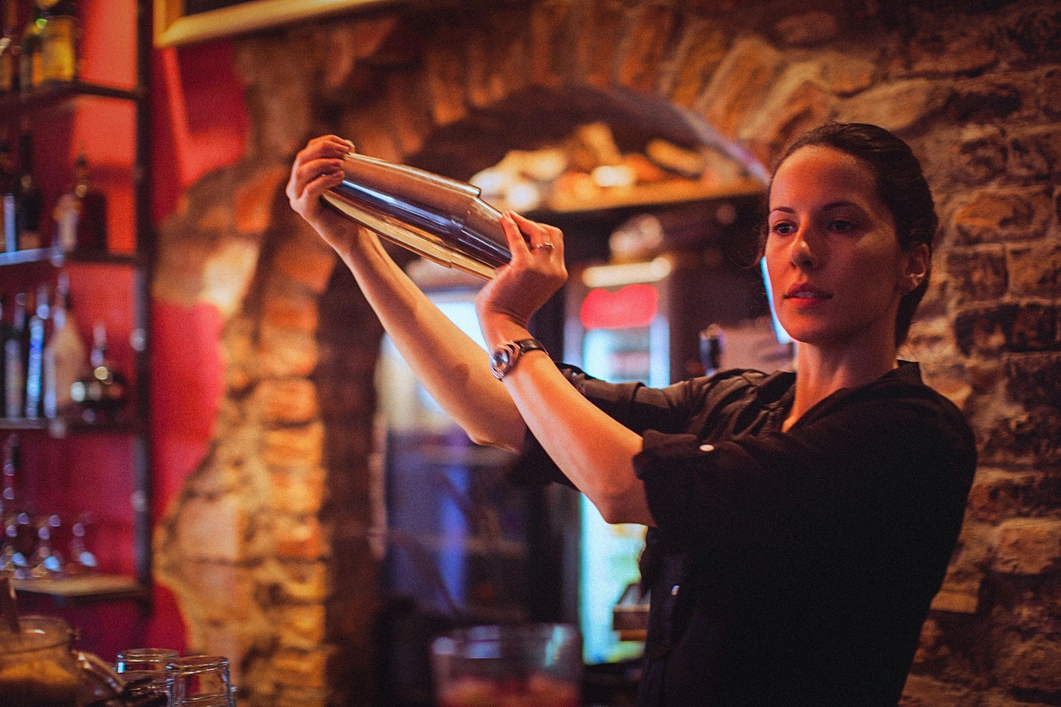Bartender shaking a cocktail at an event bar