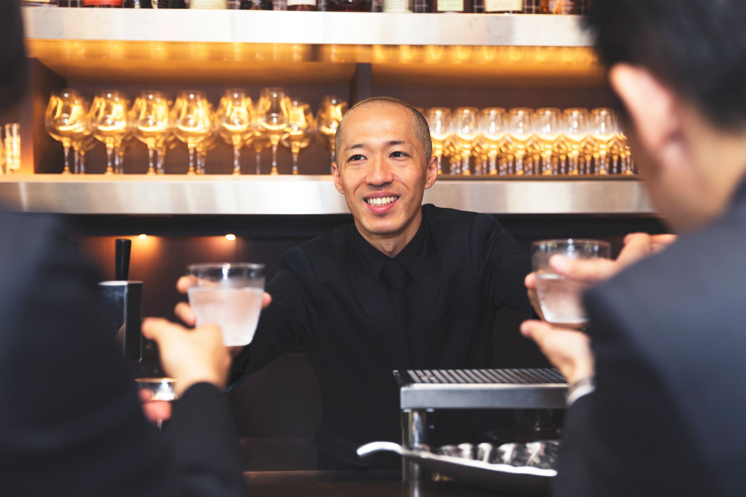 Professional bartender behind a bar