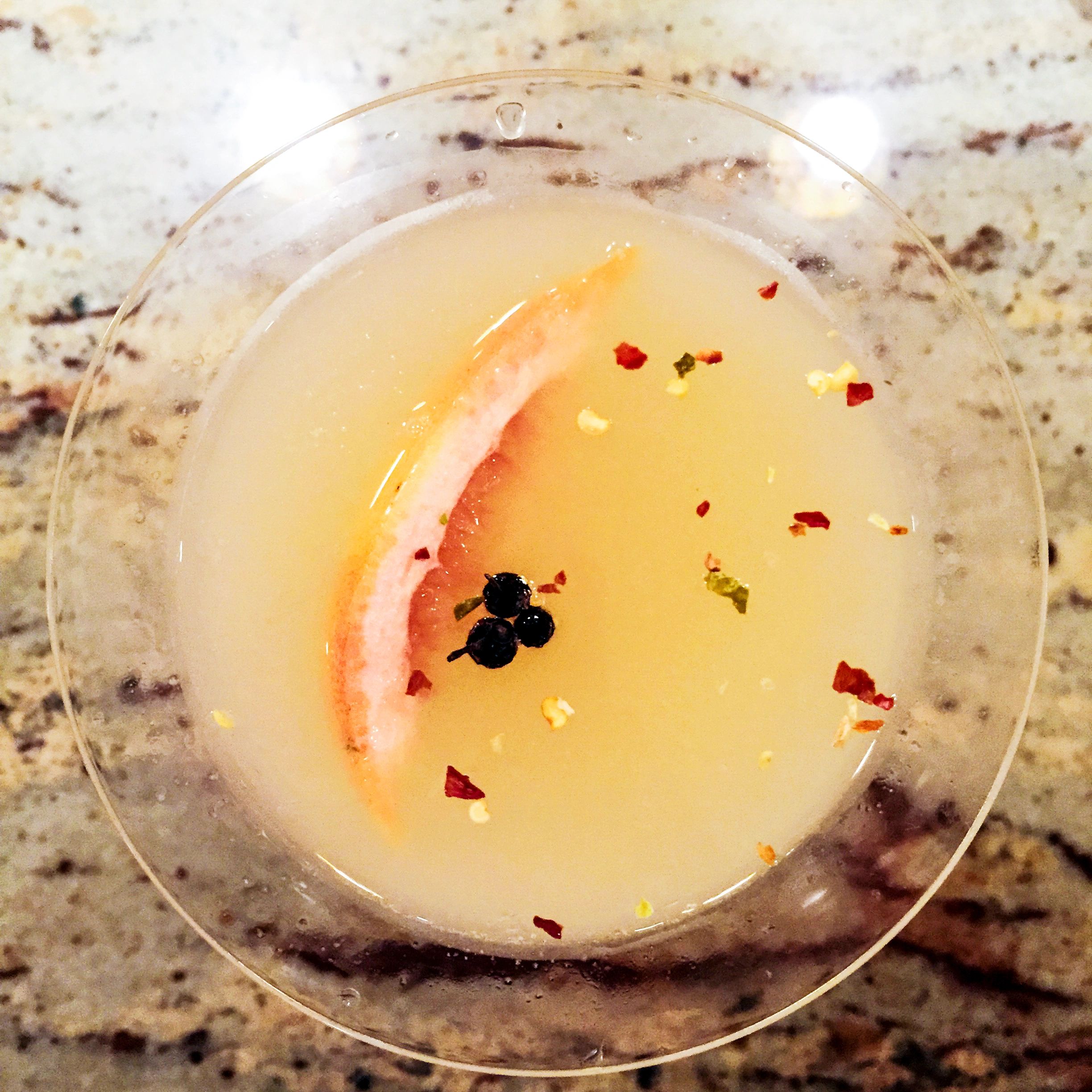 Close-up of a crafted cocktail in a martini glass